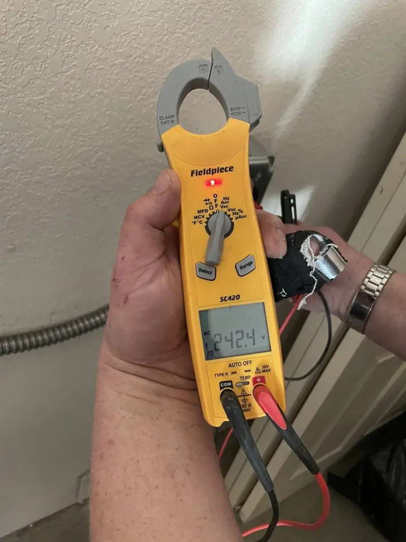 Voltage testing with clamp meter during Ceiling Fan Installation in Parole